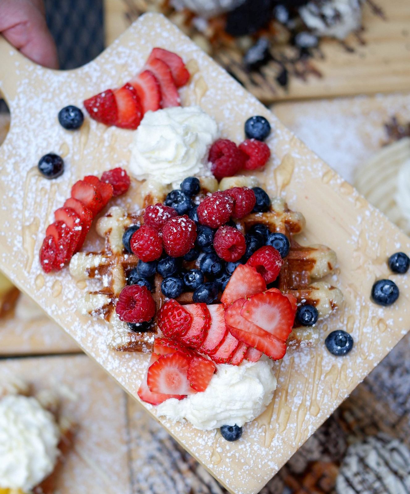 Berry Nice waffle topped with strawberries, blueberries, raspberries and cream